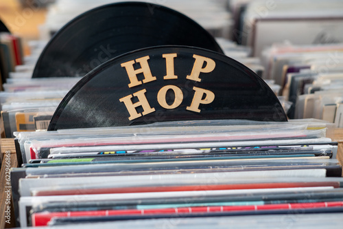 Hip hop vinyls seen stacked on rack