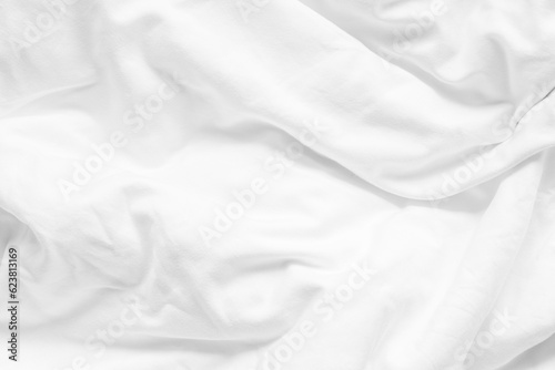 White bed sheet background, wrinkled duvet, crumpled satin blanket comforter cloth used in hotel, resort or home interior for bedding and sleep comfort