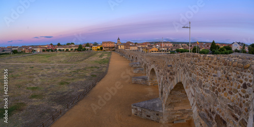 Summer's Awakening: Unveiling the Roman Bridge along the Camino de Santiago in Hospital de Orbigo, Leon, Spain