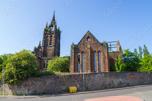 Dundyvan Parish Church in Coatbridge, Scotland. A Ruined and Fire Damaged Striking Gothic style Scots Revival church in red sandstone built in 1905