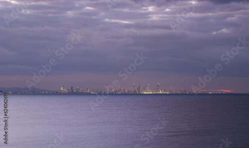 Sunset city lights view of the Gold Coast skyline seen from Coolangatta Beach, Queensland