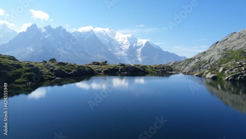 Lake Blanc at the end of Tour Mont Blanc, surrounded with snowy mountains