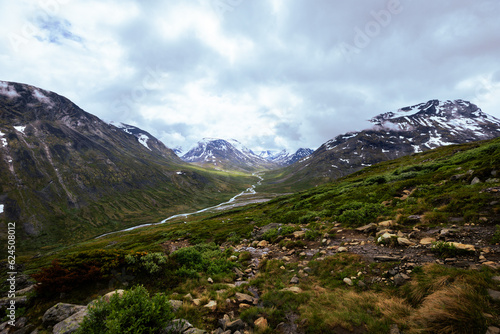 Galdhopiggen, Norway - July 3rd, 2023: The mountain landscape on the hike to the peak of Galdhopiggen In Jotunheimen National Park, Norway