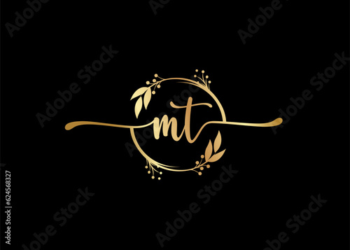 luxury gold signature initial mt logo design isolated leaf and flower