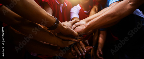 Sports team showing unity with their hands together