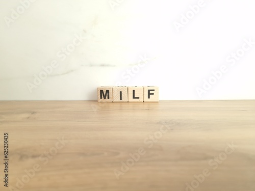 Word milf made from wooden blocks