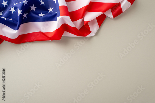 Paying homage to professionals on Labor Day: A striking overhead composition highlighting american flag against a light grey backdrop. Great for Labor Day-themed advertisements or text overlays