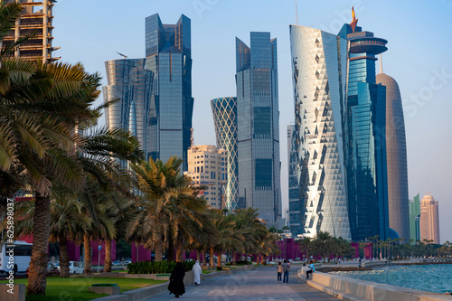  Modern glass fronted skyscrapers and office towers line the Corniche seaside in Doha, Qatar