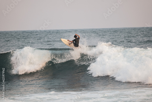 Man Surfing The Waves in SurfCity El Salvador