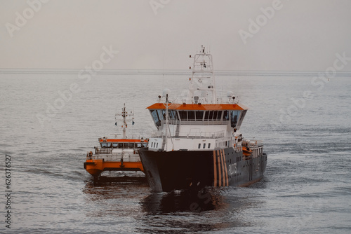Two pilot vessels while on duty during the pilot transfer operation. Maritime pilots safety. The risks associated with pilot transfer operations.
