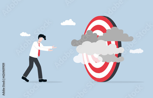 Unclear target, lack of specific business goal or direction, confusion and inefficiency due to poor business vision concept, Businessman frustrated with clouds obscuring target.