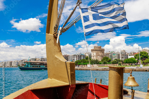 Thessaloniki view from ship. White Tower and Greek flag. Greece, Europe.