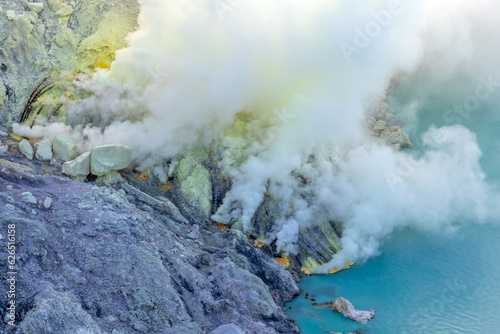 Fuming sulfur mine in Kawah Ijen crater, Indonesia