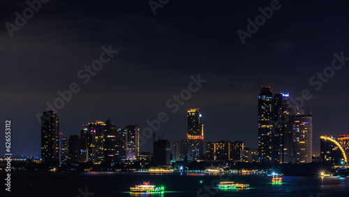 Cityscape over colors and the lights of pattaya and cruise ships in the sea, pattaya bay at night, Bali Hai View Point,