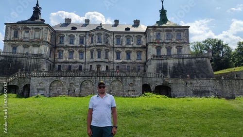 Old castle near Lviv. Podgoretsky castle. A man in front of an old castle. Castles of Ukraine