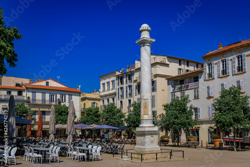 Marble column gifted to Antibes by Louis XVIII in 19th century on Place Nationale square near the provencal market in old town, South of France