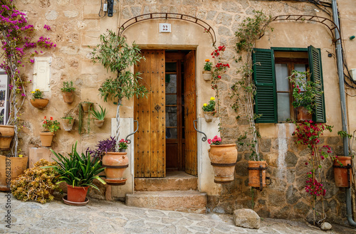 Beautiful cozy typical entrance to the house with flowers in Valldemossa, Mallorca