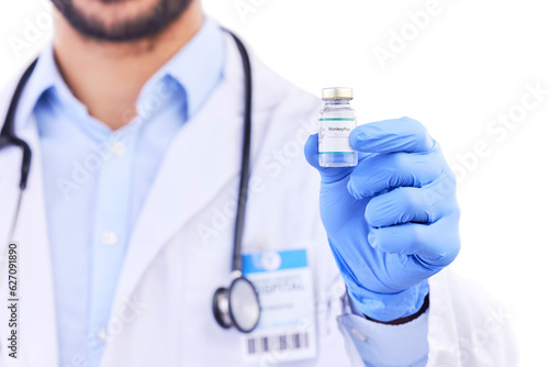 Monkeypox vaccine, medicine bottle and doctor hands with vial for healthcare, safety and immunity in studio. Closeup, medical worker and vaccination for virus, development or risk on white background