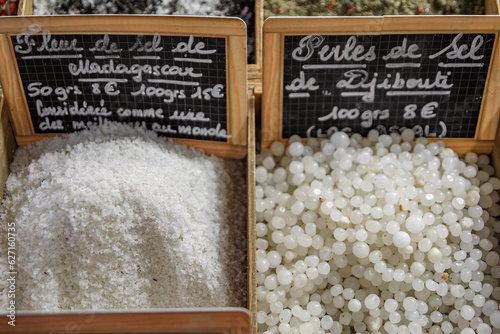 Exotic fleur de sel salt from Madagascar and African salt pearls from Djibouti at a provencal farmers market, old town Vieil Antibes, South of France