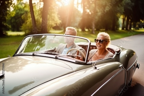 Wealthy couple in classic convertible luxury car, rich elder lifestyle