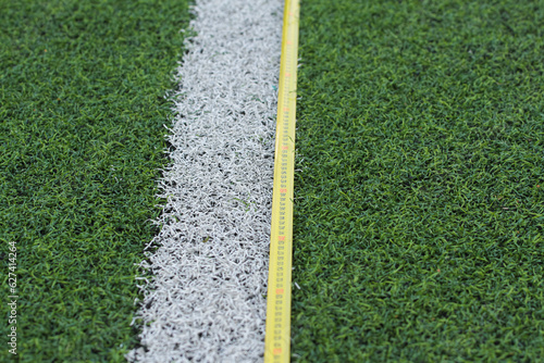 roulette, a centimeter lies on the football field, tests, measurement.