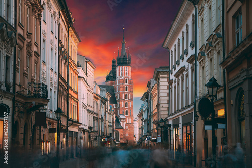 Krakow, Poland. View Of St. Mary's Basilica From Florian Street. Famous Landmark Old Landmark Church Of Our Lady Assumed Into Heaven. Saint Mary's Church. UNESCO World Heritage Site
