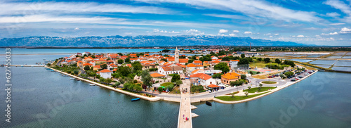 Historic town of Nin laguna aerial view with Velebit mountain background, Dalmatia region of Croatia. Aerial view of the famous Nin lagoon and medieval in Croatia