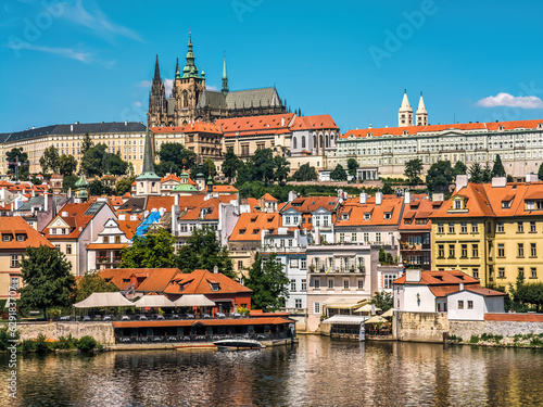 Old colorful houses and St. Vitus Cathedral in Prague.
