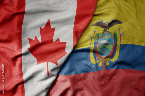 big waving realistic national colorful flag of canada and national flag of ecuador .