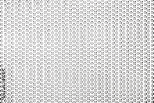 Empty white (light gray) perforated metal grid with circular holes for abstract horizontal seamless, rounded mesh plate background, steel texture, space patterns for work, modern wallpaper,close up