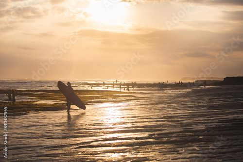 Bali sunset with surfer silhouette