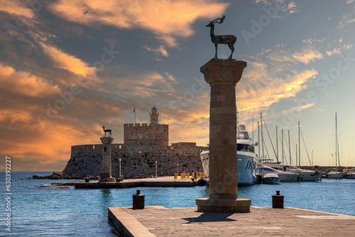 Afternoon view with the Mandraki Marina Port, symbolic deer statues where the Colossus of Rhodes stood. Rhodes, Greece