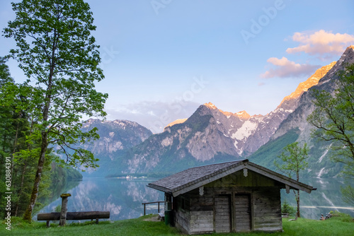 Wooden house on mountain lake Koenigssee Berchtesgaden National Park Bavaria Germany