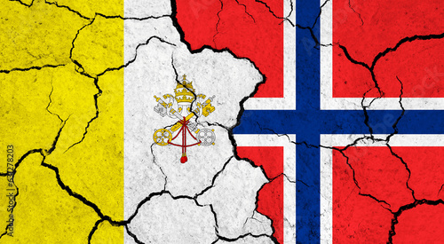Flags of Vatican City and Norway on cracked surface - politics, relationship concept