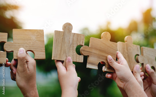 jigsaw puzzle pieces communication teamwork unite power teamwork and unity in hand teamwork concept