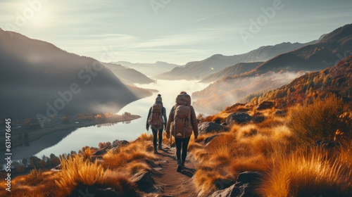 Group of male hikers admiring a scenic view from a mountain top. Adventurous young men with backpacks. Hiking and trekking on a nature trail. Traveling by foot.