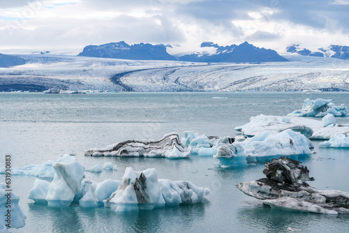 joekulsar lagoon with icebergs and eroding glacier in Iceland