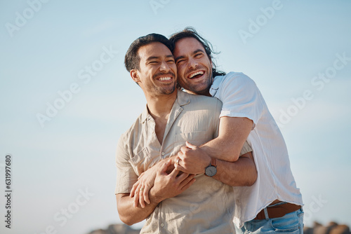 Love, hug and gay men with blue sky, embrace and smile on summer vacation together in Thailand. Sunshine, romance and marriage, happy lgbt couple relax in nature on island holiday with pride and fun.