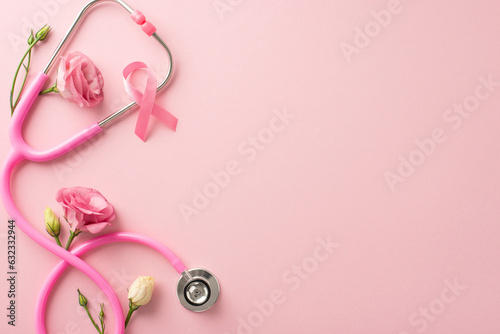 Remember the cause this International Breast Cancer Awareness Month. Top view photo of satin pink ribbon with fresh eustoma flowers on pastel pink isolated background, suitable for text or advertising