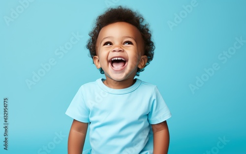 Portrait of a cute little African American baby laughing on blue background. created by generative AI technology.