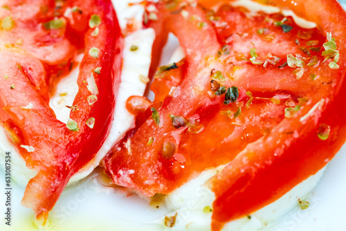 Fresh tomato slices with herbs