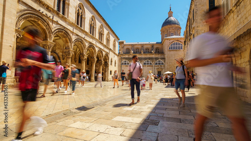Old town Dubrovnik, Croatia, street view, crowds of tourists walking through the streets, medieval architecture, bright sunny day, travel
