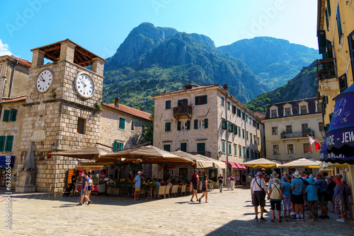 Old town Kotor, Montenegro, street view, a crowd of tourists on a square, a bright sunny day, travel