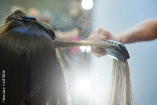 Hair straightening with keratin and a hair iron