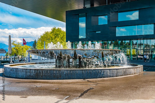 Lovely view of the famous fountain Wagenbach-Brunnen on Europaplatz with the Lucerne Culture and Congress Center in the back. The imposing fountain was built in 1934 by the architect Armin Meili.