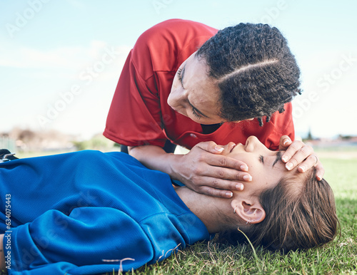 CPR, breathing check and saving woman on field for sport, fitness and game with accident and emergency. Training, paramedic and listening to lungs for breathe from injury with first aid and athlete