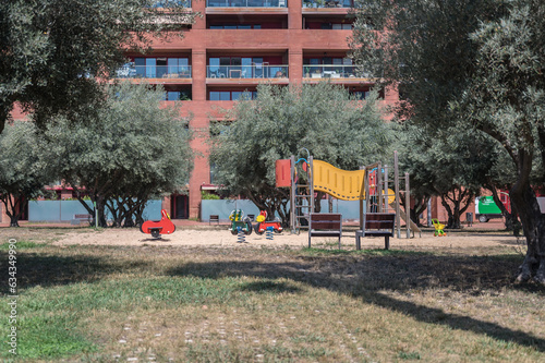 Detail of a quiet and pleasant park for children inside an island of houses in Barcelona