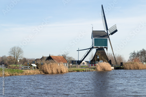 Achterlandse windmill along the Ammersche Boezem Canal near the village of Groot-Ammers in the Alblasserwaard.