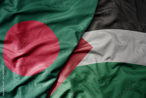 big waving realistic national colorful flag of bangladesh and national flag of palestine .