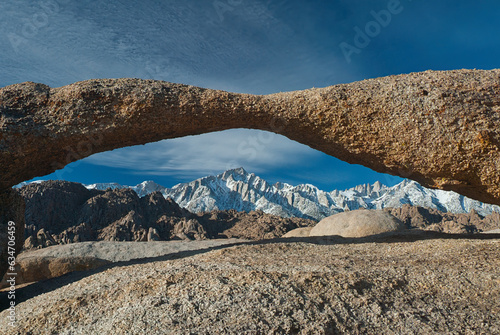 Lone Pine, California, United States –The Lathe Arch, a natural stone arch in the Alabama Hills, with Lone Pine Peak, Mt. Whitney, and the Eastern Sierras in the background.